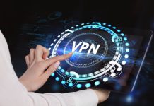 En kvindehånd, der trykker på en skærm med ordet VPN omgivet af ikoner og grafik.