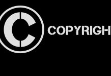 Et billede af et cirkelformet copyright-symbol med ordet "copyright" skrevet ud.