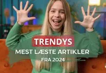 En kvinde i en grøn trøje sidder på en orange sofa med hænderne oppe. Teksten på billedet siger "TRENDYS MEST LÆSTE ARTIKLER FRA 2024".