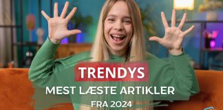 En kvinde i en grøn trøje sidder på en orange sofa med hænderne oppe. Teksten på billedet siger "TRENDYS MEST LÆSTE ARTIKLER FRA 2024".