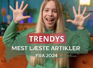 En kvinde i en grøn trøje sidder på en orange sofa med hænderne oppe. Teksten på billedet siger "TRENDYS MEST LÆSTE ARTIKLER FRA 2024".