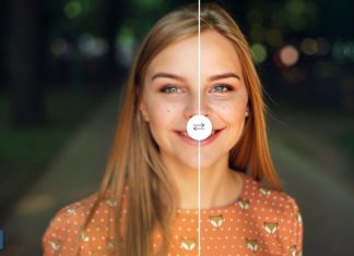 En ung kvinde står på en sti i en park. Hun har langt, rødt hår og er klædt i en orange bluse med hvide prikker og et rævemotiv.